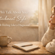Woman reflecting on attachment styles in relationships at a cozy desk with journal and tea