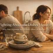 Couple sitting back-to-back in kitchen after arguments about chores in relationships